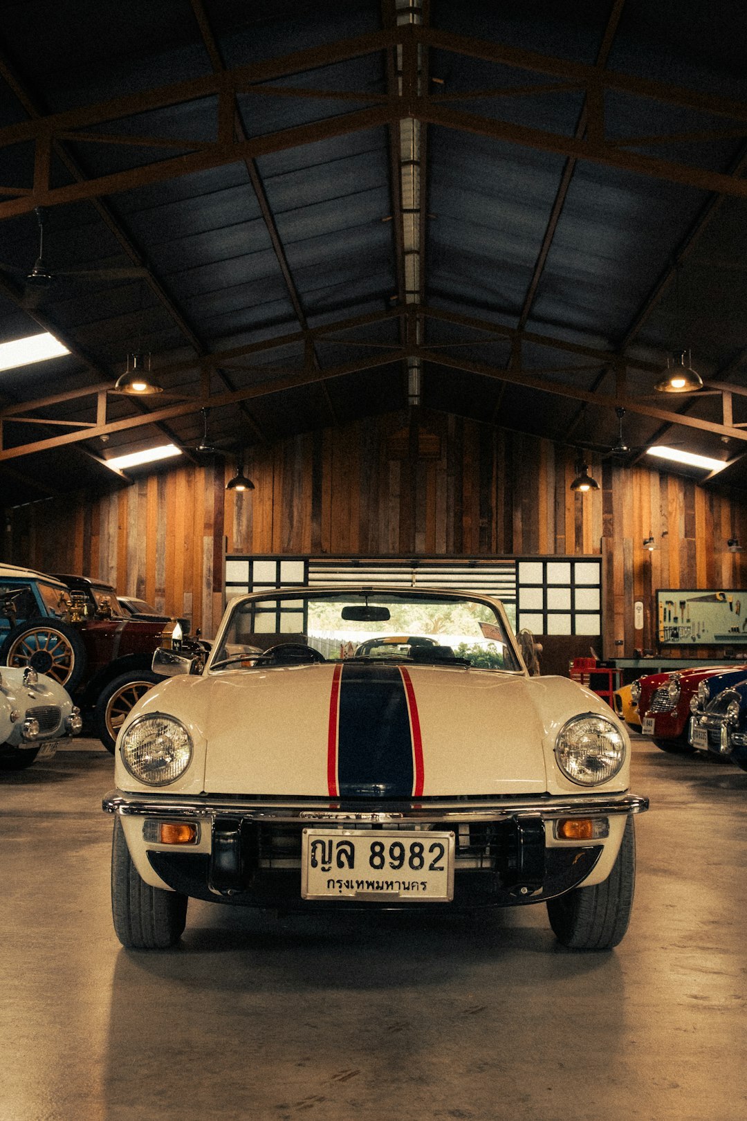 Interior of a fascinating private garage with multiple classic cars in Montevideo