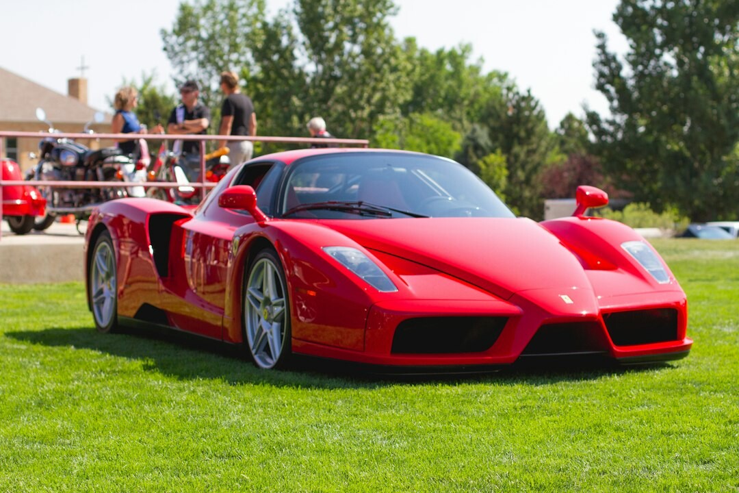 Vintage Ferrari displayed at an elegant automobile auction event