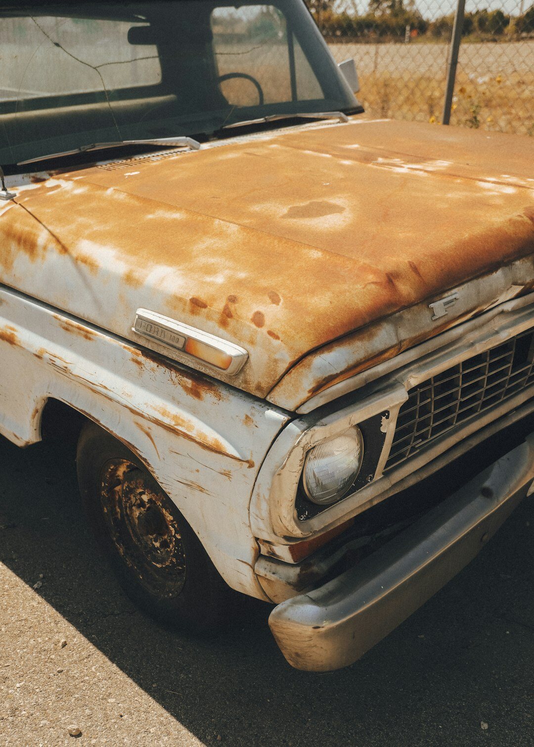 Weathered classic car parked on a rural road in Uruguay