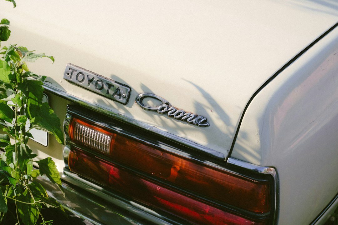 Classic 1970s grand tourer parked on a historic street