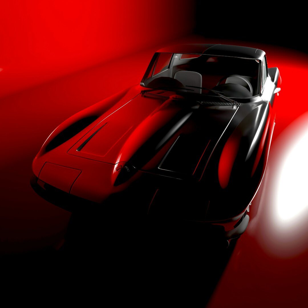 Classic 1960s sports car photographed in studio lighting