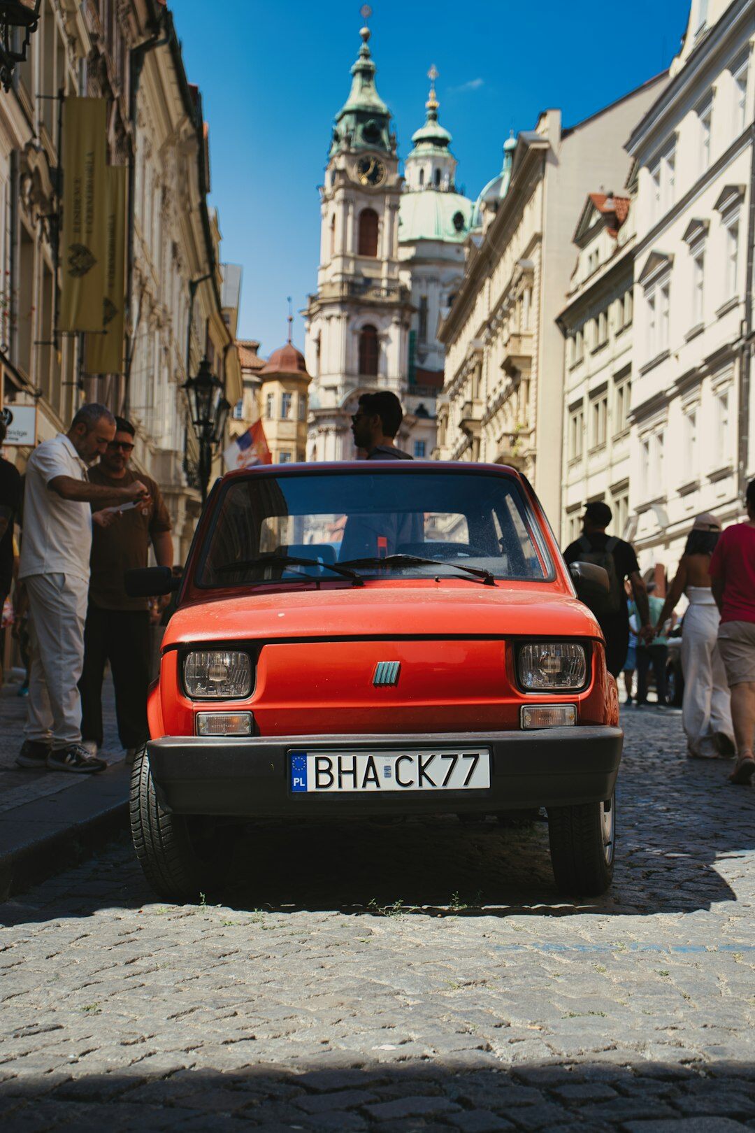 Classic car rally driving through the cobblestone streets of Colonia del Sacramento