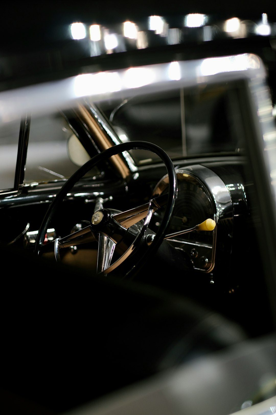 Interior of a classic car museum in Montevideo with vintage automobiles on display